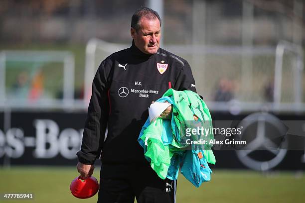 Head coach Huub Stevens walks on the pitch during a VfB Stuttgart training session at the club's training ground on March 11, 2014 in Stuttgart,...