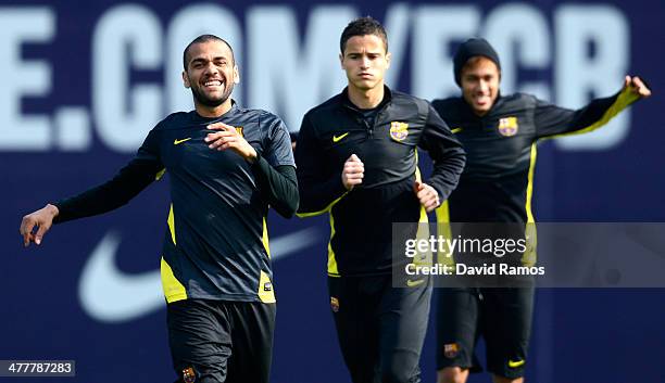 Dani Alves, Ibrahim Afellay and Neymar of FC Barcelona warm up during a training session ahead the UEFA Champions League Round of 16 second Leg match...