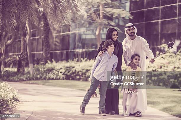 arab family in park taking selfie - men selfie wide stock pictures, royalty-free photos & images