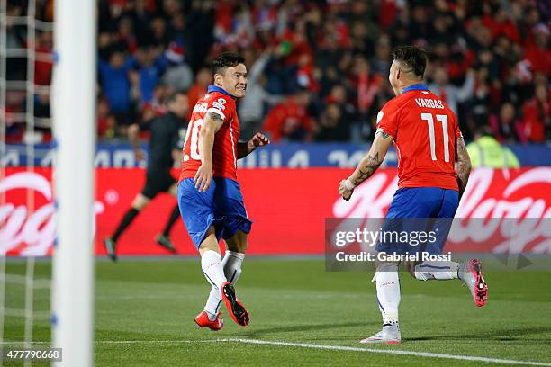 Charles Aranguiz of Chile celebrates with teammate Eduardo Vargas after scoring the opening goal during the 2015 Copa America Chile Group A match...