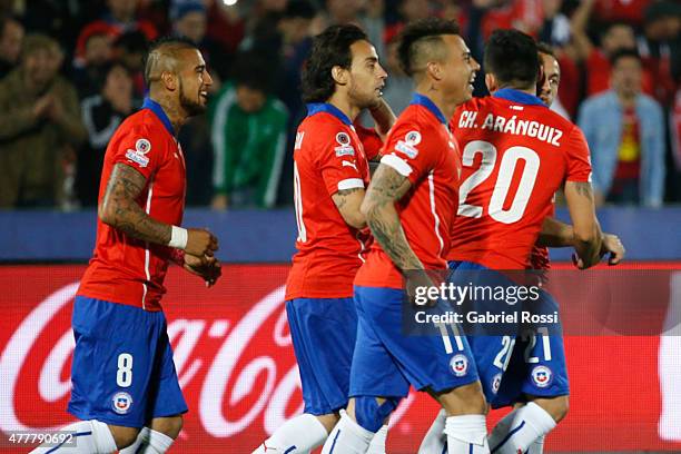 Charles Aranguiz of Chile celebrates with teammates after scoring the opening goal during the 2015 Copa America Chile Group A match between Chile and...