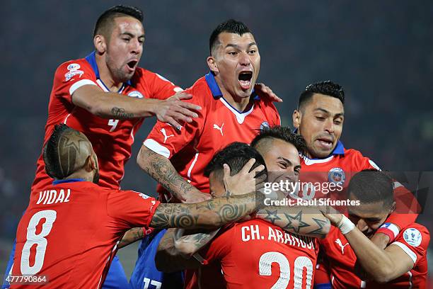 Charles Aranguiz of Chile celebrates with teammates after scoring the opening goal during the 2015 Copa America Chile Group A match between Chile and...