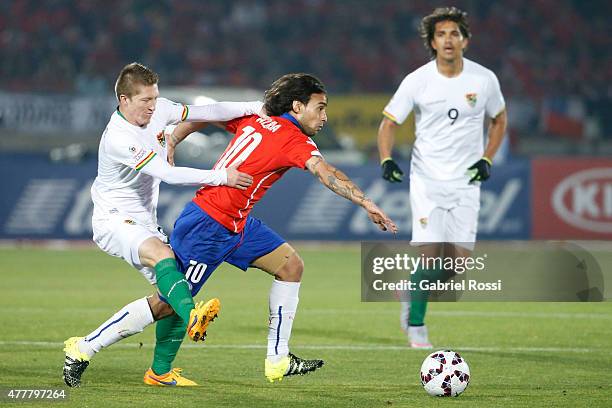 Jorge Valdivia of Chile fights for the ball with Alejandro Chumacero of Bolivia during the 2015 Copa America Chile Group A match between Chile and...
