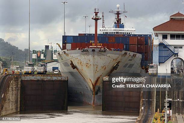 Cargo ship full of containers sails in the Miraflores locks in the Panama Canal, 25kms noreast of Panama City, 16 October, 2006. A referendum will be...