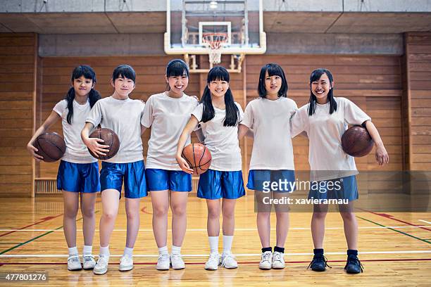 basketball girls team in the school gymnasium - japan 12 years girl stock pictures, royalty-free photos & images