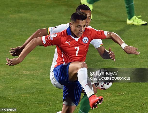 Chile's forward Alexis Sanchez is marked by Bolivia's defender Edemir Rodriguez during their 2015 Copa America football championship match, in...