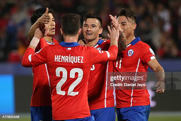 Charles Aranguiz of Chile celebrates with teammates after scoring the third goal of his team during the 2015 Copa America Chile Group A match between...