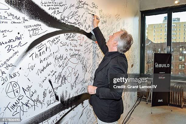 Actor Alan Rickman signs the wall at the AOL Build Speaker Series at AOL Studios In New York on June 19, 2015 in New York City.