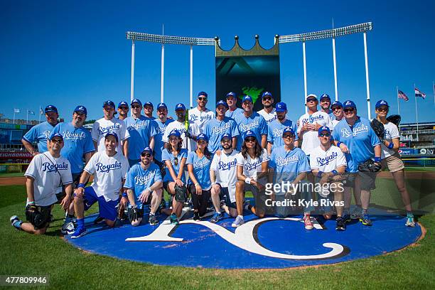 Participants pose for a photo before the celebrity softball game for the Big Slick Celebrity Weekend benefiting Children's Mercy Hospital Kansas City...