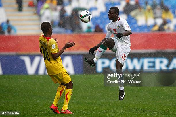 Remi Nassalan of Senegal kicks the ball over Dieudonne Gbakle of Mali during the FIFA U-20 World Cup Third Place Play-off match between Senegal and...