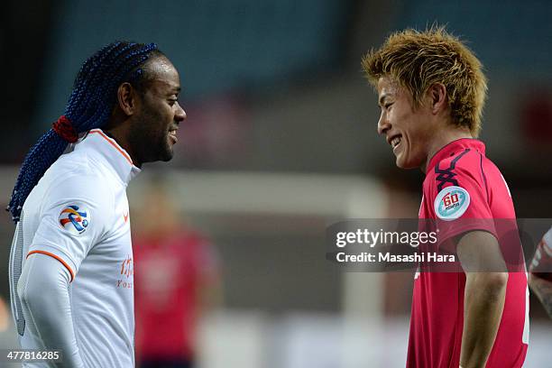 Yoichiro Kakitani of Cerezo Osaka and Vagner Love of Shandong Luneng FC look on during the AFC Champions League Group E match between Cerezo Osaka...