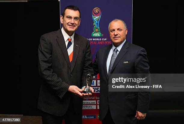 Presentation is made between Bill Moran the Chair of the LOC and Hany Abo Rida the Chairman of the Organising Committee and FIFA Exco member during...
