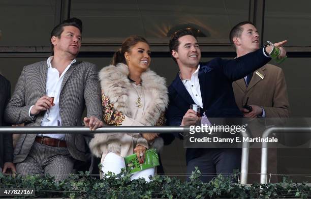Phil Turner, Katie Price and husband Kieran Hayler watch the second race on day 1 of The Cheltenham Festical at Cheltenham Racecourse on March 11,...