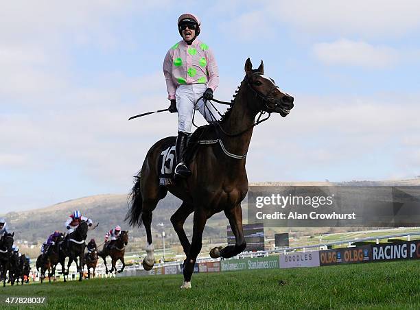Ruby Walsh riding Vautour win The Sky Bet Supreme Novices' Hurdle Race at Cheltenham racecourse on March 11, 2014 in Cheltenham, England.