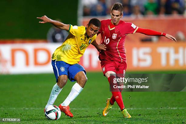 Gabriel Jesus of Brazil holds bask Mijat Gacinovic of Serbia during the FIFA U-20 World Cup Final match between Brazil and Serbia at North Harbour...