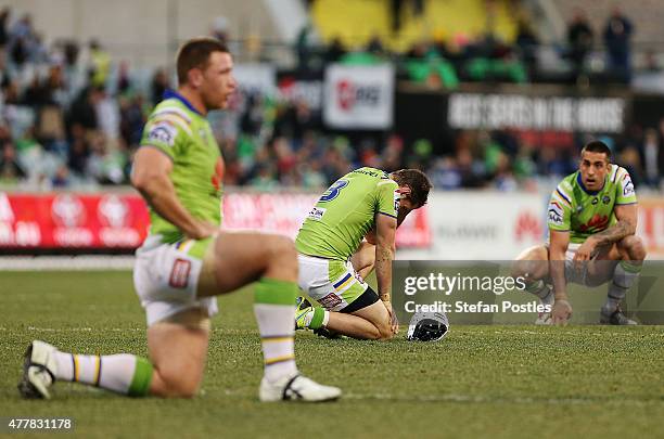 Jarrod Croker of the Raiders reacts after Johnathan Thurston of the Cowboys kicks a field goal to win the round 15 NRL match between the Canberra...