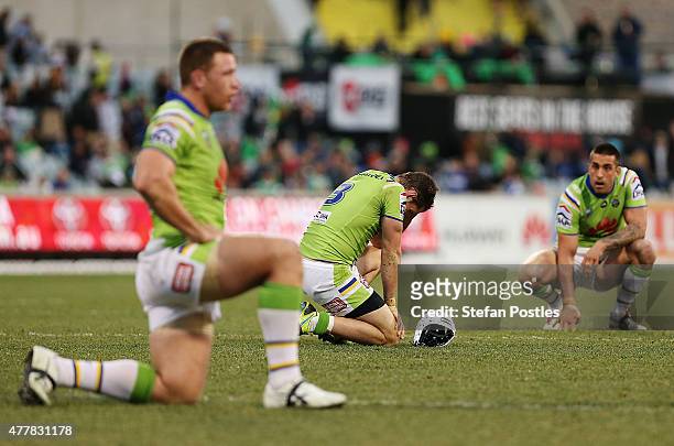 Jarrod Croker of the Raiders reacts after Johnathan Thurston of the Cowboys kicks a field goal to win the round 15 NRL match between the Canberra...