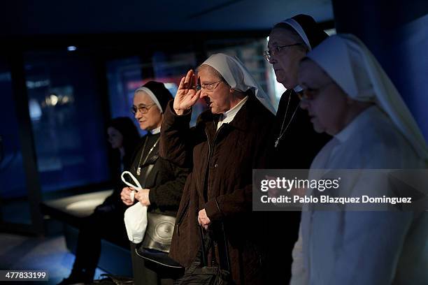Nuns pray for the victims of Madrid train bombings in a memorial monument at Atocha railway station during the 10th anniversary on March 11, 2014 in...