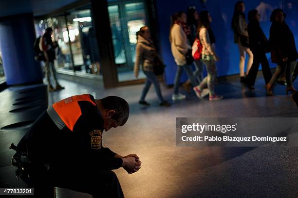 Security man visits the memorial monument for the victims of Madrid train bombings at Atocha railway station during the 10th anniversary on March 11,...