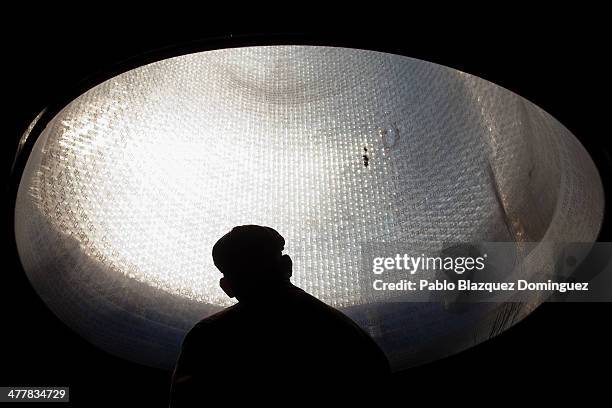 Man visits the memorial monument for the victims of Madrid train bombings at Atocha railway station during the 10th anniversary on March 11, 2014 in...