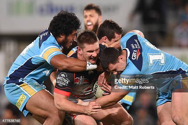 Jacob Lillyman of the Warriors is tackled during the round 15 NRL match between the Gold Coast Titans and the New Zealand Warriors at Cbus Super...