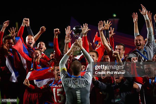 Predrag Rajkovic of Serbia holds up the trophy following the FIFA U-20 World Cup Final match between Brazil and Serbia at North Harbour Stadium on...