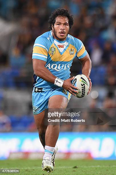 Agnatius Paasi of the Titans runs with the ball during the round 15 NRL match between the Gold Coast Titans and the New Zealand Warriors at Cbus...