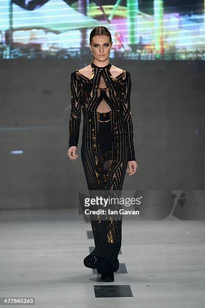 Model walks the runway at the Raisa-Vanessa Sason show during MBFWI presented by American Express Fall/Winter 2014 on March 11, 2014 in Istanbul,...