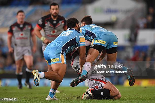 Nathan Friend of the Warriors is tackled high during the round 15 NRL match between the Gold Coast Titans and the New Zealand Warriors at Cbus Super...