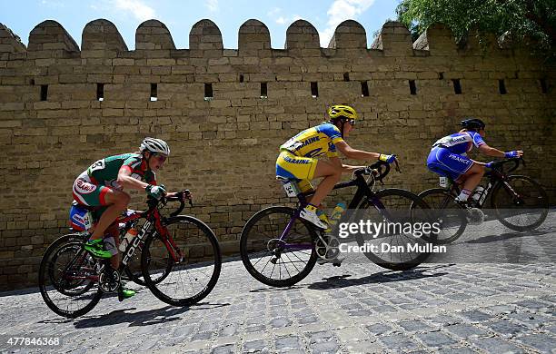Volha Antonava of Belarus, Ganna Solovei of Ukraine and Fiona Dutriaux of France make a climb through the Old Town during the Women's Road Race on...
