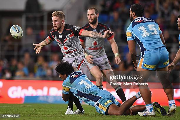 Sam Tomkins of the Warriors offloads the ball during the round 15 NRL match between the Gold Coast Titans and the New Zealand Warriors at Cbus Super...