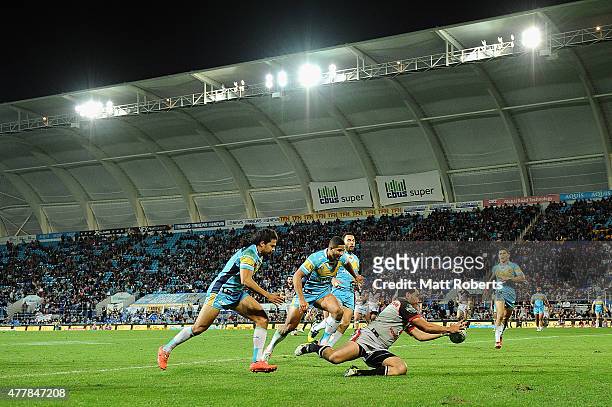 Konrad Hurrell of the Warriors scores a try during the round 15 NRL match between the Gold Coast Titans and the New Zealand Warriors at Cbus Super...
