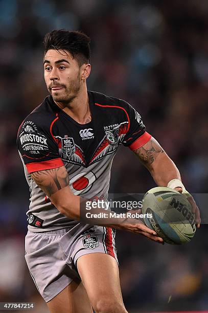 Shaun Johnson of the Warriors looks to passs the ball during the round 15 NRL match between the Gold Coast Titans and the New Zealand Warriors at...