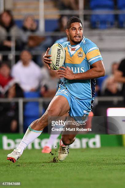 Nene MacDonald of the Titans runs with the ball during the round 15 NRL match between the Gold Coast Titans and the New Zealand Warriors at Cbus...