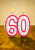 Burning birthday candles number 60