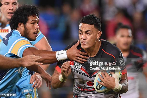 Ken Maumalo of the Warriors is tackled during the round 15 NRL match between the Gold Coast Titans and the New Zealand Warriors at Cbus Super Stadium...
