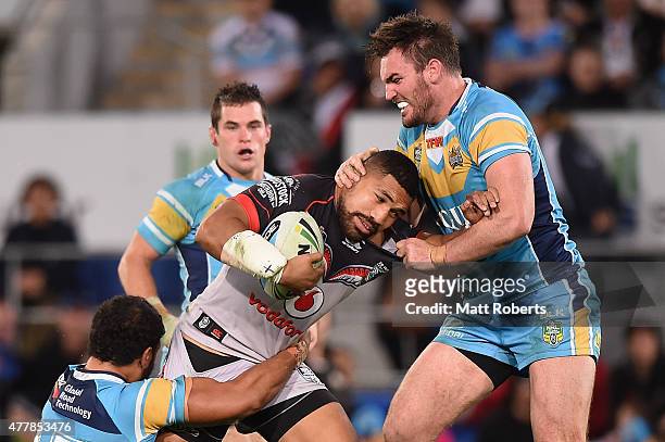 Siliva Havili of the Warriors is tackled during the round 15 NRL match between the Gold Coast Titans and the New Zealand Warriors at Cbus Super...