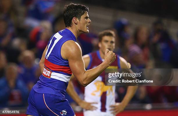 Tom Boyd of the Bulldogs celebrates after scoring a goal during the round 12 AFL match between the Western Bulldogs and the Brisbane Lions at Etihad...