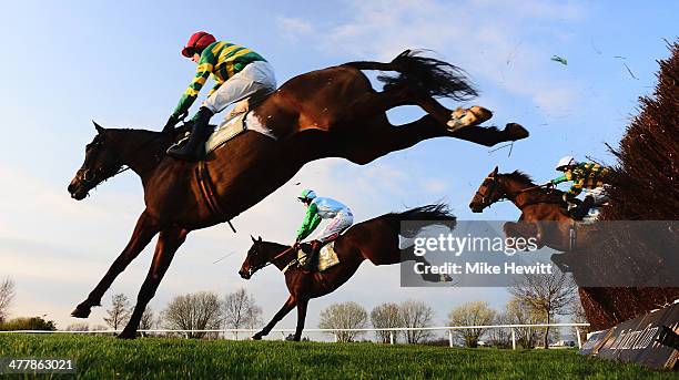 Brendan Powell on Present View on their way to victory in the Rewards4Racing Novices' Handicap Chase with Festive Affair nearest camera at Cheltenham...