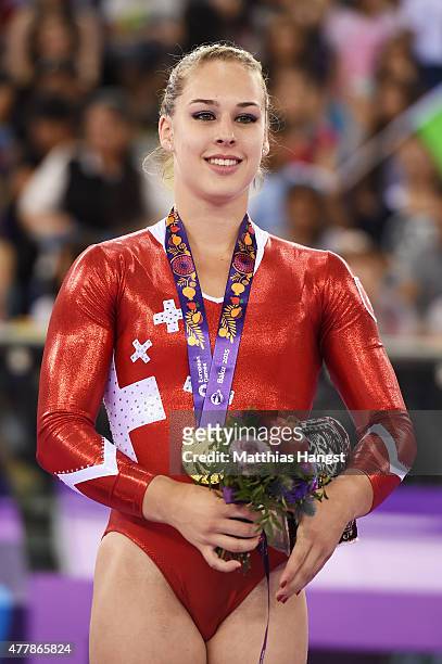 Gold medalist Giulia Steingruber of Switzerland stands on the podium during the medal ceremony for the Women's Vault final on day eight of the Baku...