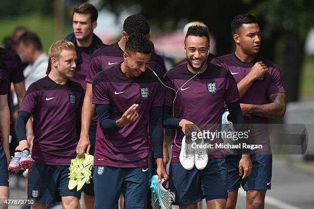 Jesse Lingard looks on with Nathan Redmond as the squad walk to the England U21 training session and press conference on June 20, 2015 in Olomouc,...
