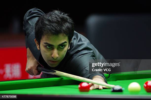 Pankaj Advani of India plays a shot in quarter-finals match against Luca Brecel of Belgium on day six of Snooker World Cup 2015 at Wuxi Stadium on...