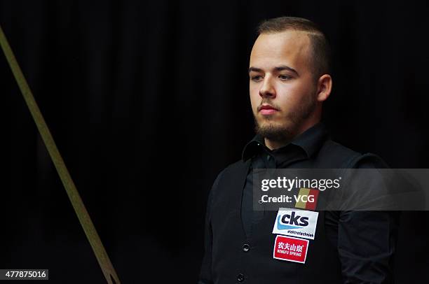 Luca Brecel of Belgium reacts in quarter-finals match against Pankaj Advani of India on day six of Snooker World Cup 2015 at Wuxi Stadium on June 20,...