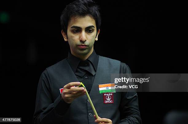 Pankaj Advani of India chalks his cue in quarter-finals match against Luca Brecel of Belgium on day six of Snooker World Cup 2015 at Wuxi Stadium on...