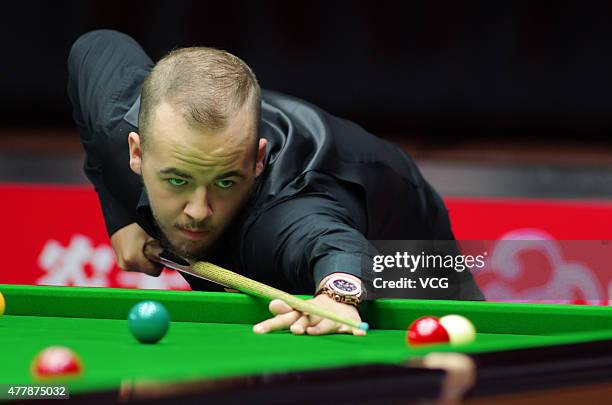 Luca Brecel of Belgium plays a shot in quarter-finals match against Pankaj Advani of India on day six of Snooker World Cup 2015 at Wuxi Stadium on...