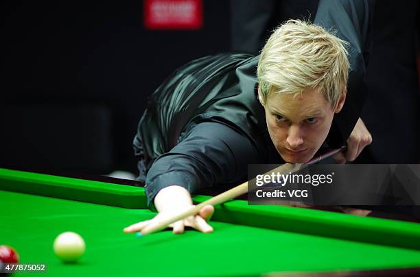 Neil Robertson of Australia plays a shot in quarter-finals match with Vinnie Calabrese of Australia against Zhou Yuelong and Yan Bingtao of China B...