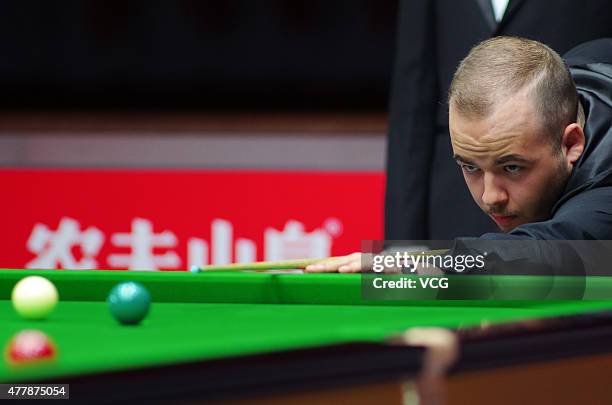 Luca Brecel of Belgium plays a shot in quarter-finals match against Pankaj Advani of India on day six of Snooker World Cup 2015 at Wuxi Stadium on...