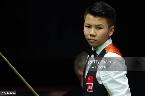 Zhou Yuelong of China B reacts in quarter-finals match with Yan Bingtao of China B against Neil Robertson and Vinnie Calabrese of Australia on day...