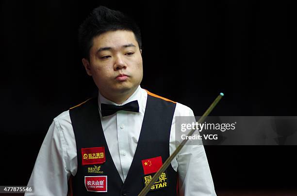 Ding Junhui of China A reacts in quarter-finals match with Xiao Guodong of China A against John Higgins and Stephen Maguire of Scotland on day six of...