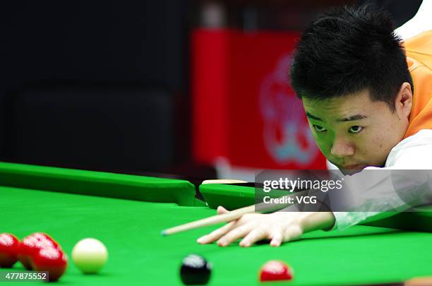 Ding Junhui of China A plays a shot in quarter-finals match with Xiao Guodong of China A against John Higgins and Stephen Maguire of Scotland on day...